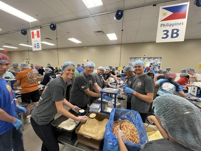 Grand Canyon Home Services workers packing food for Feed My Starving Children in Tempe, Az.