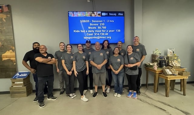 Grand Canyon Home Services team volunteering with Feed My Starving Children. 