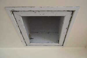Before and after images of a cleaned residential air duct vent