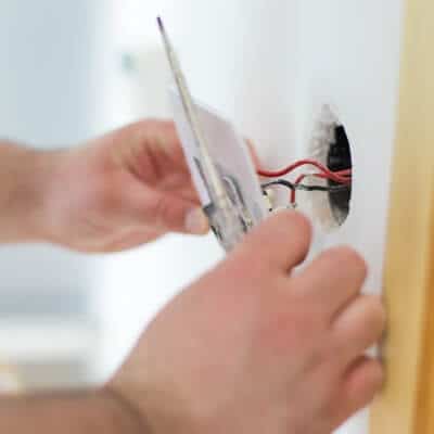 Hands Instaling Electrical Outlet