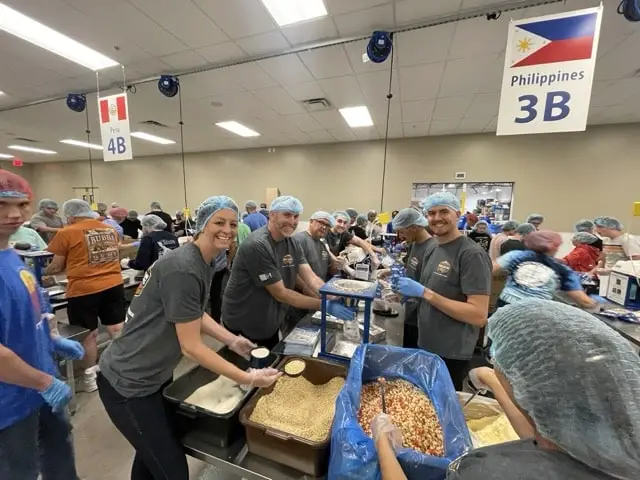 Grand Canyon Home Services workers packing food for Feed My Starving Children in Tempe, Az.