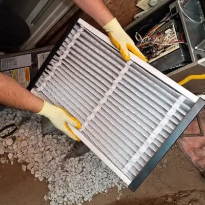 Hands Holding Air Filter